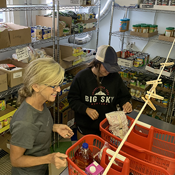 Nantucket Food Pantry volunteers packing food boxes for clients