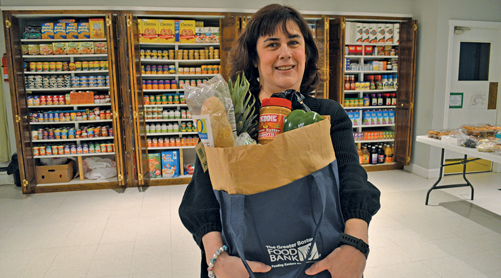 Kelly holding her bag of groceries