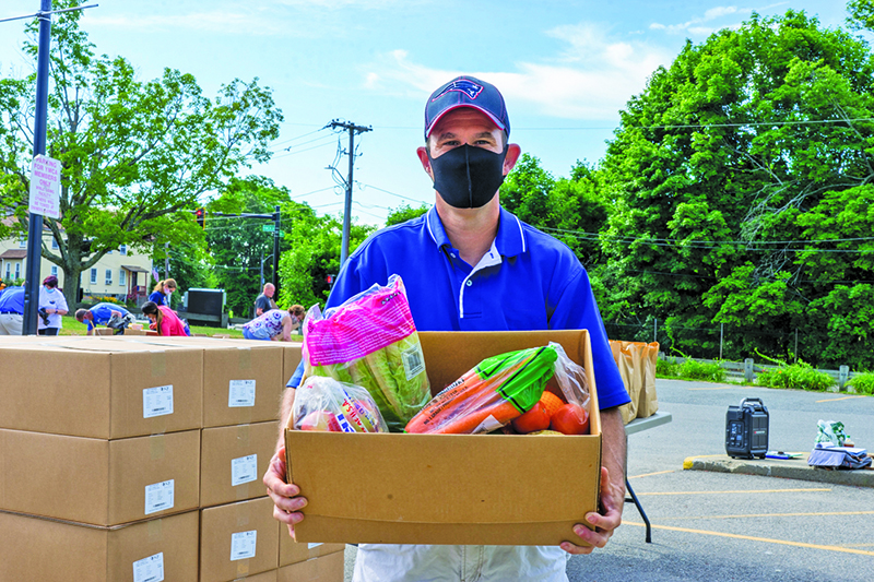 Keith carry a box of healthy food