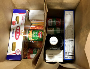 Bags full of food for CSFP boxes.