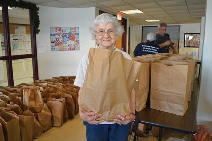 Senior receiving food from GBFB