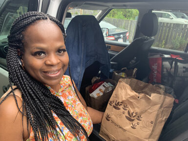 Nantucket Food Pantry client Stephanie with her bag full of healthy food.