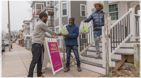 Jean Louis delivering food to his neighbors.