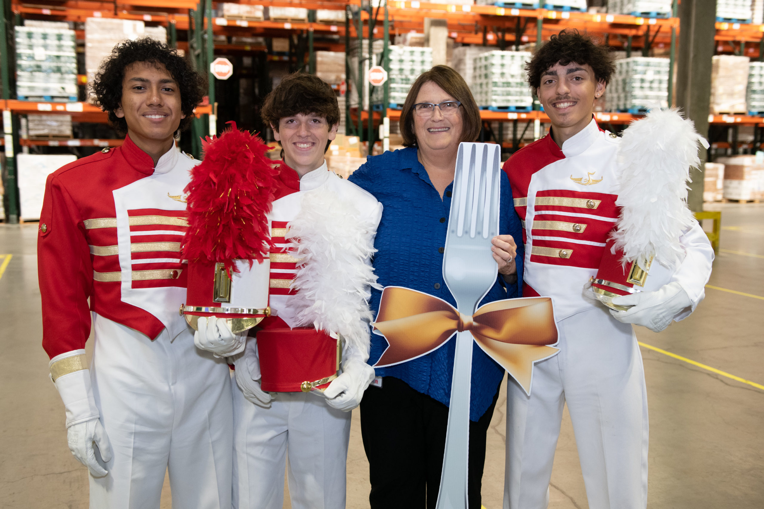 Members of the Everett High School Crimson Tide Marching Band, recipients of this year's Nally Award, with Catherine D'Amato