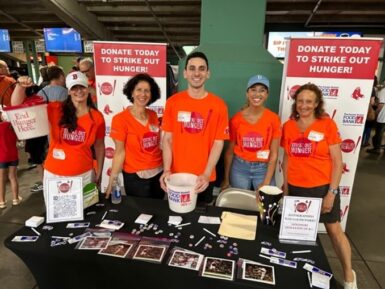 Team GBFB wears orange for Strike Out Hunger Day at Fenway Park