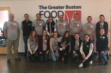 A group of volunteers from MFS poses after their shift at The Greater Boston Food Bank