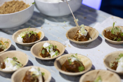 Table with samples of a lamb meatball tasting dish